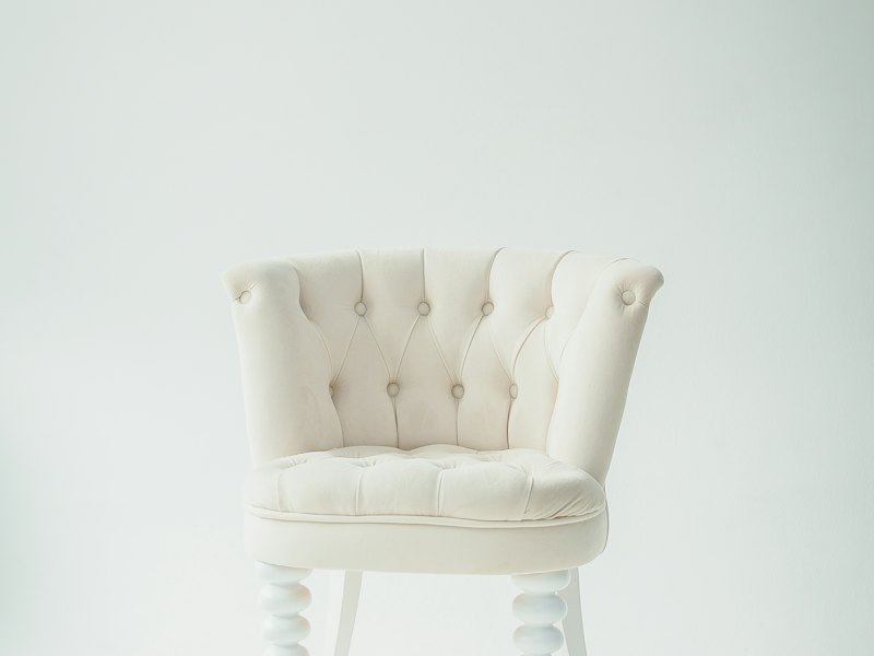 White tufted accent chair, solid wood legs
